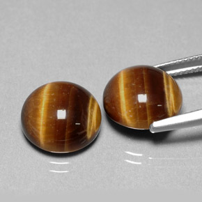 Натуральный коричневый tiger's eye  карата огранка круг, непрозрачный