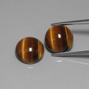 Натуральный коричневый tiger's eye  карата огранка круг, непрозрачный