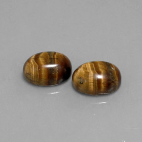 Натуральный коричневый tiger's eye  карата огранка овал, непрозрачный