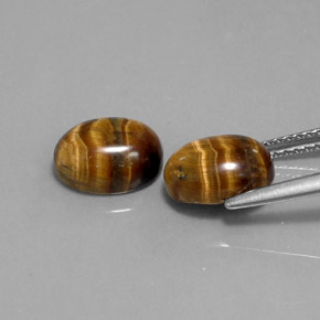 Натуральный коричневый tiger's eye  карата огранка овал, непрозрачный