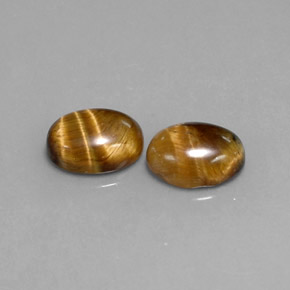Натуральный коричневый tiger's eye  карата огранка овал, непрозрачный