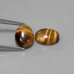 Натуральный коричневый tiger's eye  карата огранка овал, непрозрачный
