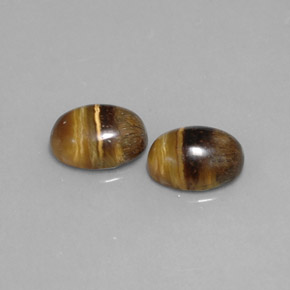 Натуральный коричневый tiger's eye  карата огранка овал, непрозрачный