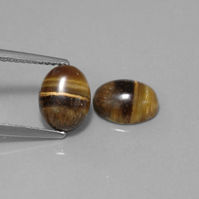 Натуральный коричневый tiger's eye  карата огранка овал, непрозрачный