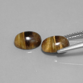 Натуральный коричневый tiger's eye  карата огранка овал, непрозрачный