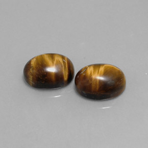 Натуральный коричневый tiger's eye  карата огранка овал, непрозрачный