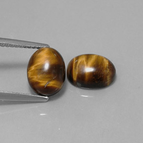 Натуральный коричневый tiger's eye  карата огранка овал, непрозрачный