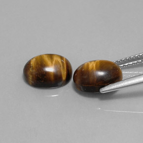 Натуральный коричневый tiger's eye  карата огранка овал, непрозрачный