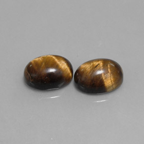 Натуральный коричневый tiger's eye  карата огранка овал, непрозрачный