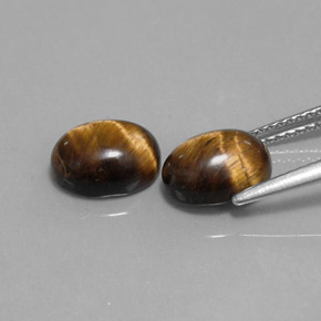 Натуральный коричневый tiger's eye  карата огранка овал, непрозрачный