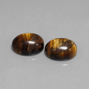 Натуральный коричневый tiger's eye  карата огранка овал, непрозрачный