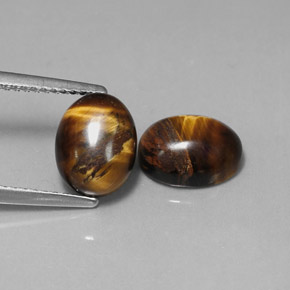 Натуральный коричневый tiger's eye  карата огранка овал, непрозрачный