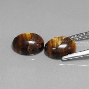 Натуральный коричневый tiger's eye  карата огранка овал, непрозрачный