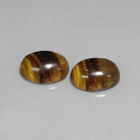 Натуральный коричневый tiger's eye  карата огранка овал, непрозрачный