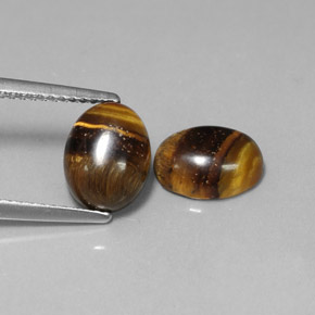 Натуральный коричневый tiger's eye  карата огранка овал, непрозрачный