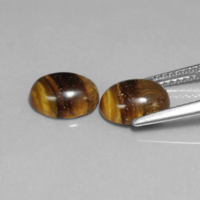 Натуральный коричневый tiger's eye  карата огранка овал, непрозрачный