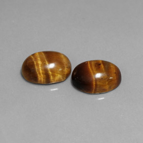 Натуральный коричневый tiger's eye  карата огранка овал, непрозрачный