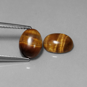 Натуральный коричневый tiger's eye  карата огранка овал, непрозрачный