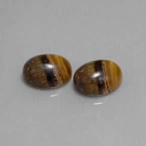 Натуральный коричневый tiger's eye  карата огранка овал, непрозрачный