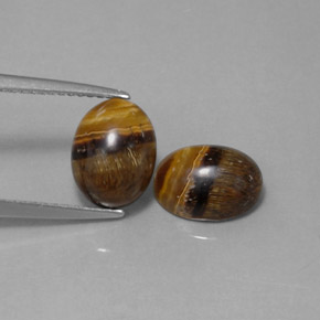 Натуральный коричневый tiger's eye  карата огранка овал, непрозрачный
