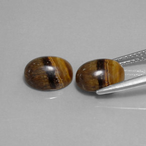 Натуральный коричневый tiger's eye  карата огранка овал, непрозрачный