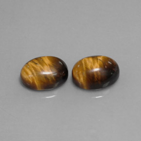 Натуральный коричневый tiger's eye  карата огранка овал, непрозрачный