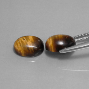 Натуральный коричневый tiger's eye  карата огранка овал, непрозрачный