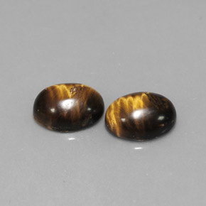 Натуральный коричневый tiger's eye  карата огранка овал, непрозрачный