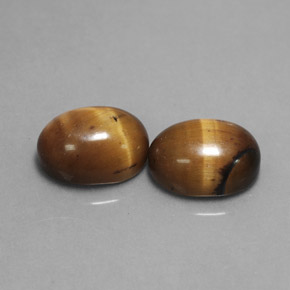 Натуральный коричневый tiger's eye  карата огранка овал, непрозрачный