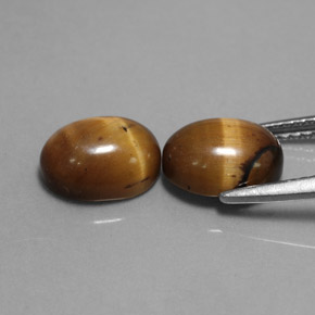 Натуральный коричневый tiger's eye  карата огранка овал, непрозрачный