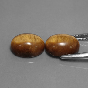 Натуральный коричневый tiger's eye  карата огранка овал, непрозрачный