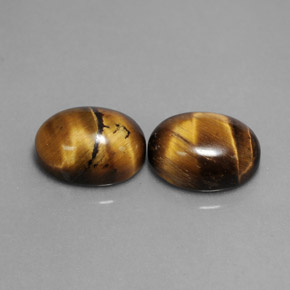 Натуральный коричневый tiger's eye  карата огранка овал, непрозрачный