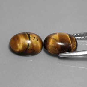 Натуральный коричневый tiger's eye  карата огранка овал, непрозрачный