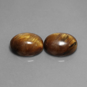 Натуральный коричневый tiger's eye  карата огранка овал, непрозрачный