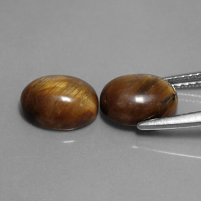 Натуральный коричневый tiger's eye  карата огранка овал, непрозрачный