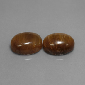 Натуральный коричневый tiger's eye  карата огранка овал, непрозрачный