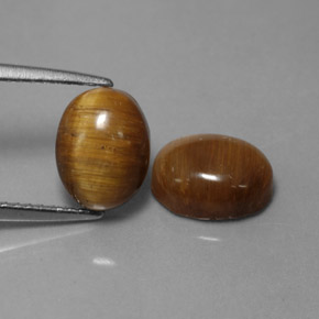 Натуральный коричневый tiger's eye  карата огранка овал, непрозрачный