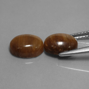 Натуральный коричневый tiger's eye  карата огранка овал, непрозрачный