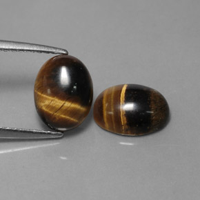 Натуральный коричневый tiger's eye  карата огранка овал, непрозрачный