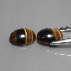 Натуральный коричневый tiger's eye  карата огранка овал, непрозрачный