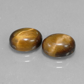 Натуральный коричневый tiger's eye  карата огранка овал, непрозрачный