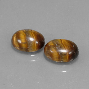 Натуральный коричневый tiger's eye  карата огранка овал, непрозрачный