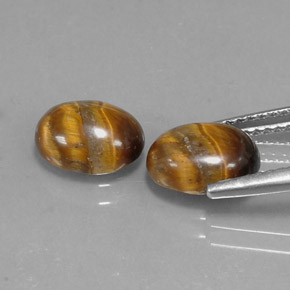 Натуральный коричневый tiger's eye  карата огранка овал, непрозрачный