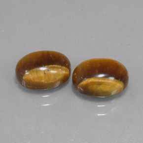 Натуральный коричневый tiger's eye  карата огранка овал, непрозрачный