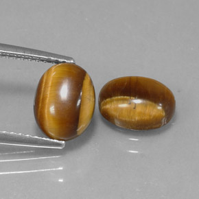 Натуральный коричневый tiger's eye  карата огранка овал, непрозрачный