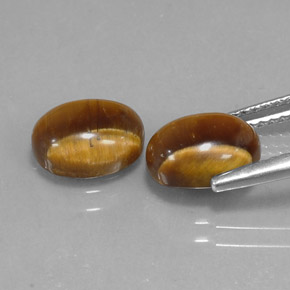 Натуральный коричневый tiger's eye  карата огранка овал, непрозрачный