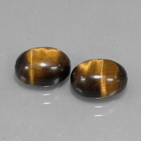 Натуральный коричневый tiger's eye  карата огранка овал, непрозрачный