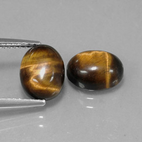 Натуральный коричневый tiger's eye  карата огранка овал, непрозрачный