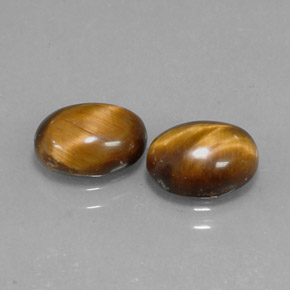 Натуральный коричневый tiger's eye 1,59 карата огранка овал, непрозрачный