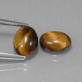 Натуральный коричневый tiger's eye 1,59 карата огранка овал, непрозрачный
